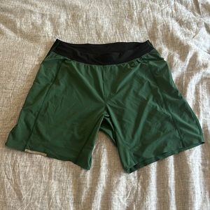Green Lululemon shorts with zipper on back.